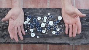 Hands working on buttons